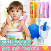A young child holds two filled popsicle bags, with a blue popsicle maker and empty bags in the background.