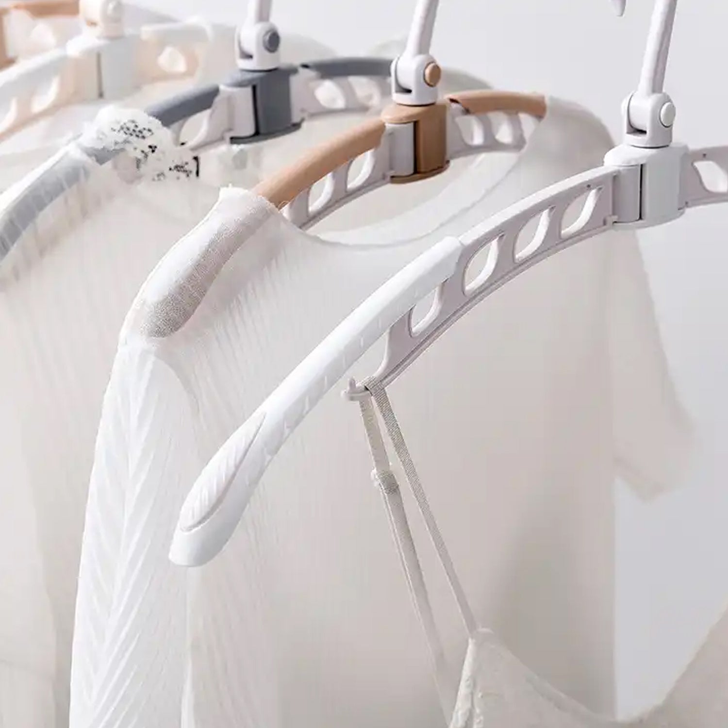 Close-up of the adjustable mechanism on the folding clothes hanger