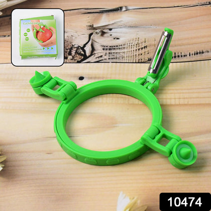 Person using an adjustable apple peeler with a holder ring to peel a red apple