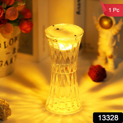 Crystal lamp glowing with soft light on a dark surface