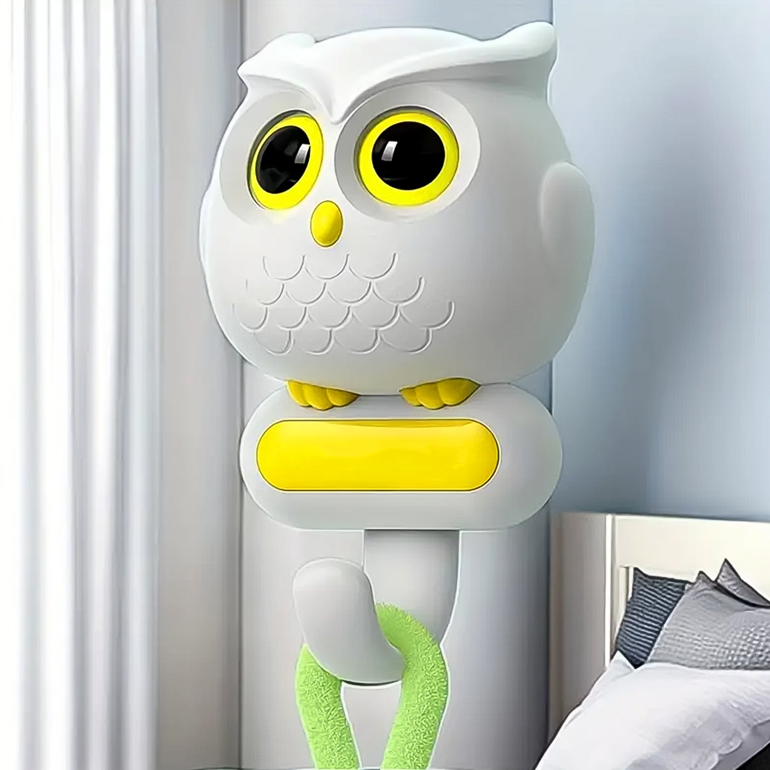 Close-up of the self-adhesive wall hook, highlighting the detailed bird shape and sturdy build.