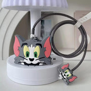 A gray Tom character silicone charger cover with a striped cable protector and small matching connector cover on a white
