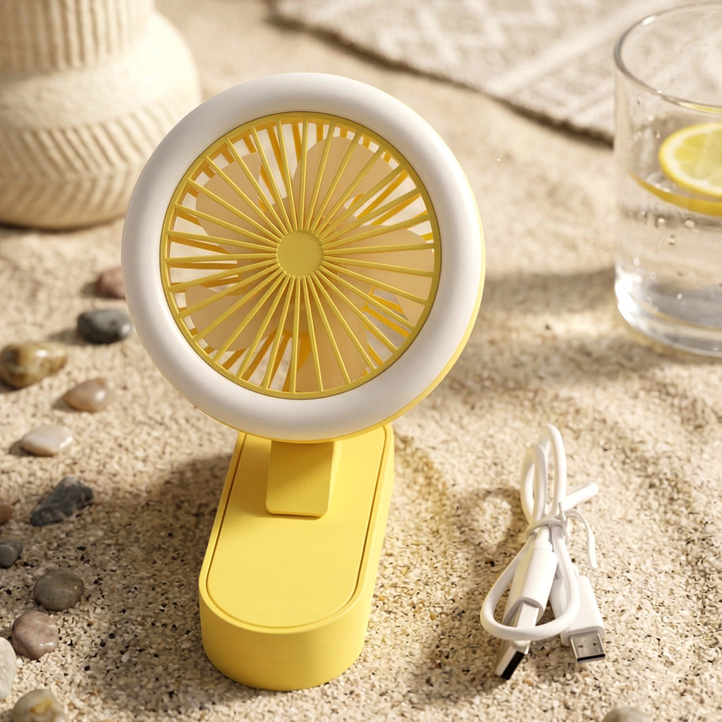 Foldable portable rechargeable mini fan on desk