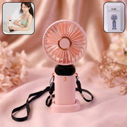The rechargeable portable fan standing upright on a desk, providing cooling airflow.
