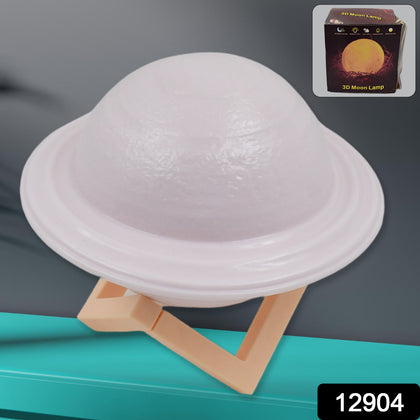 3D Saturn Lamp with base illuminated in a dark room