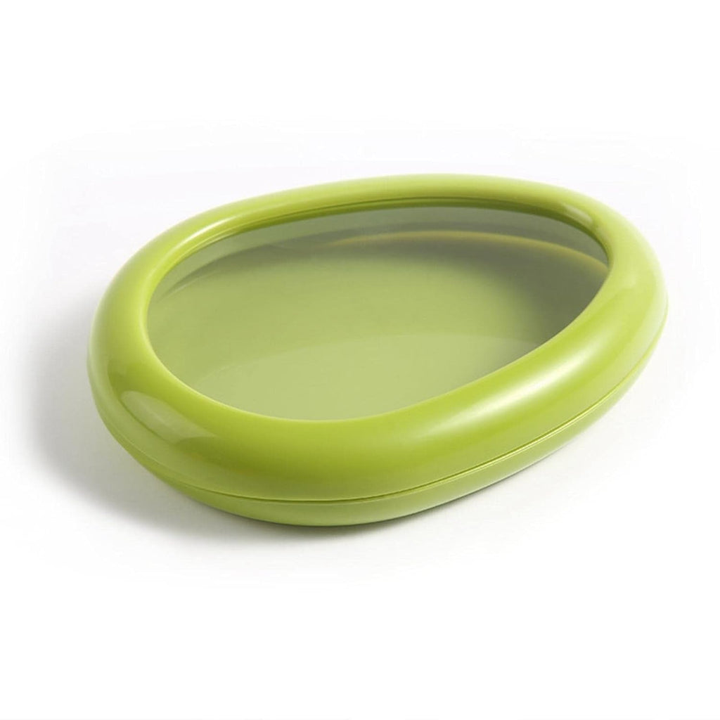 Green oval vegetable container in kitchen setting