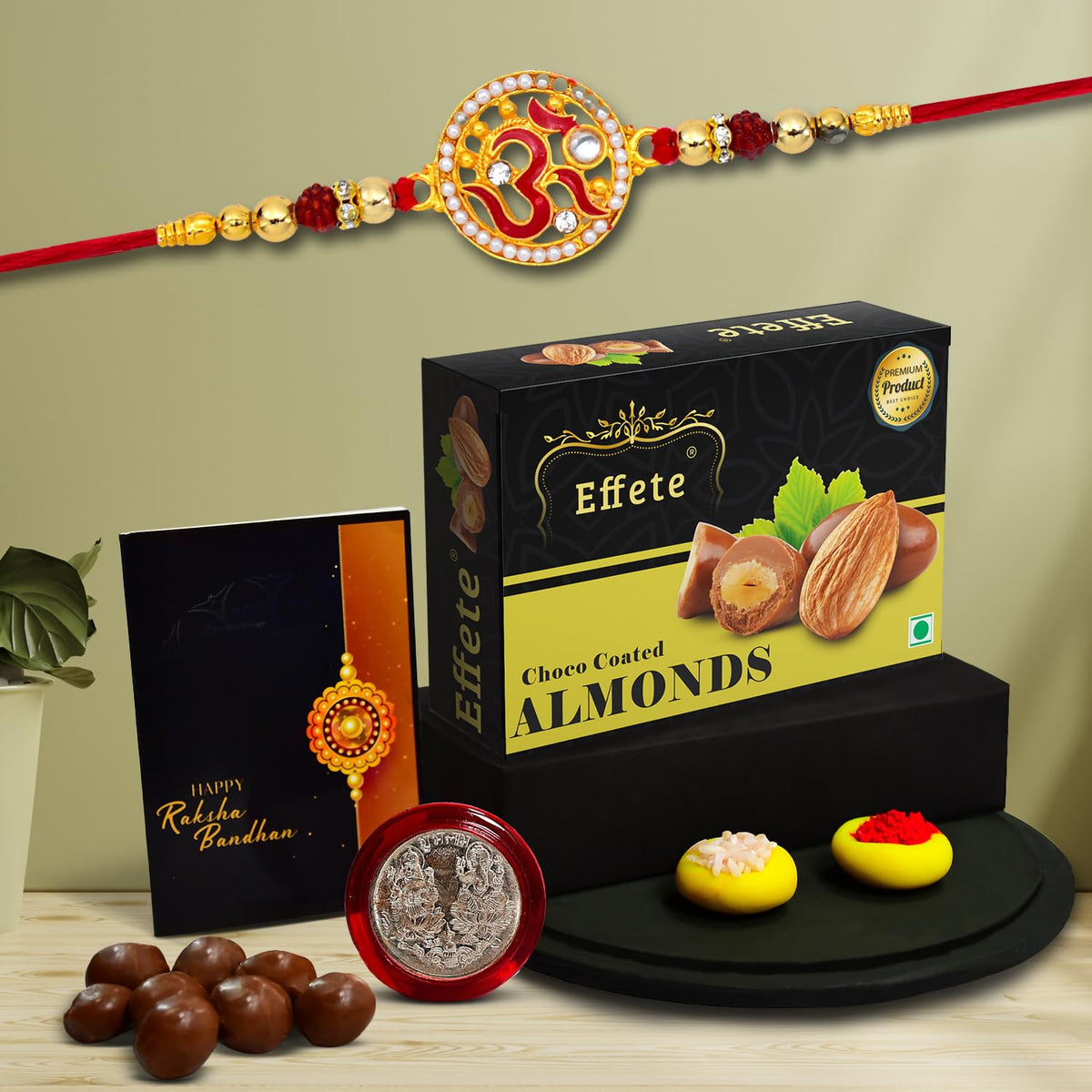 Rakshabandhan Om design Rakhi set with chocolate almonds and festive items