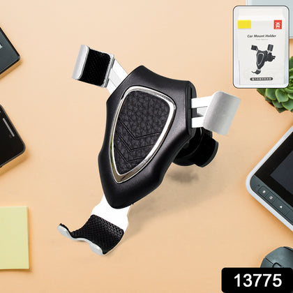 Gravity car phone mount holding a smartphone in a vehicle