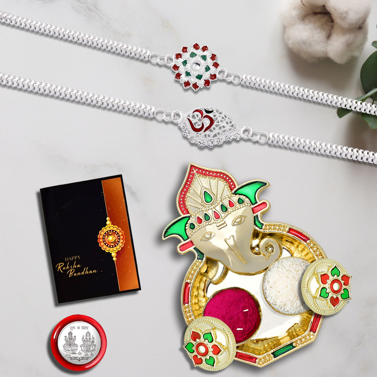 Traditional Rakhi Combo Gift Set by Wukusy with Rakhi, roli-chawal, coin, greeting card, and chocolate.