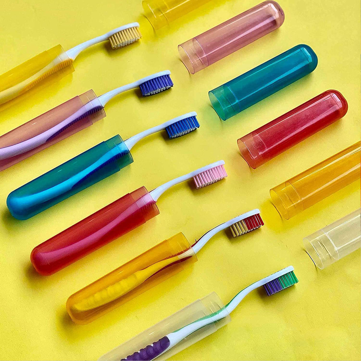Six plastic toothbrush cases in various colors