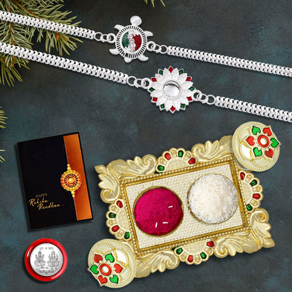 Complete Raksha Bandhan Rakhi gift set featuring a decorative Rakhi, roli-chawal, coin, card, and chocolate.