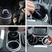 Portable car ashtray next to a pack of cigarettes for scale