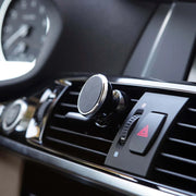 Close-up of the magnetic car mobile holder on a car dashboard