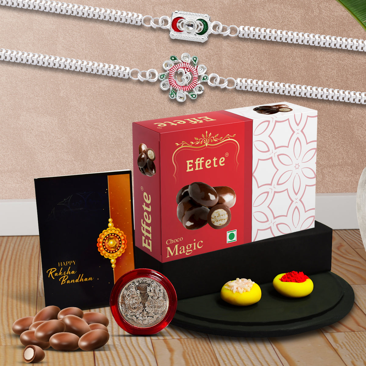 Rakhi Combo Gift Set featuring a Rakhi, roli-chawal, coin, greeting card, & chocolate