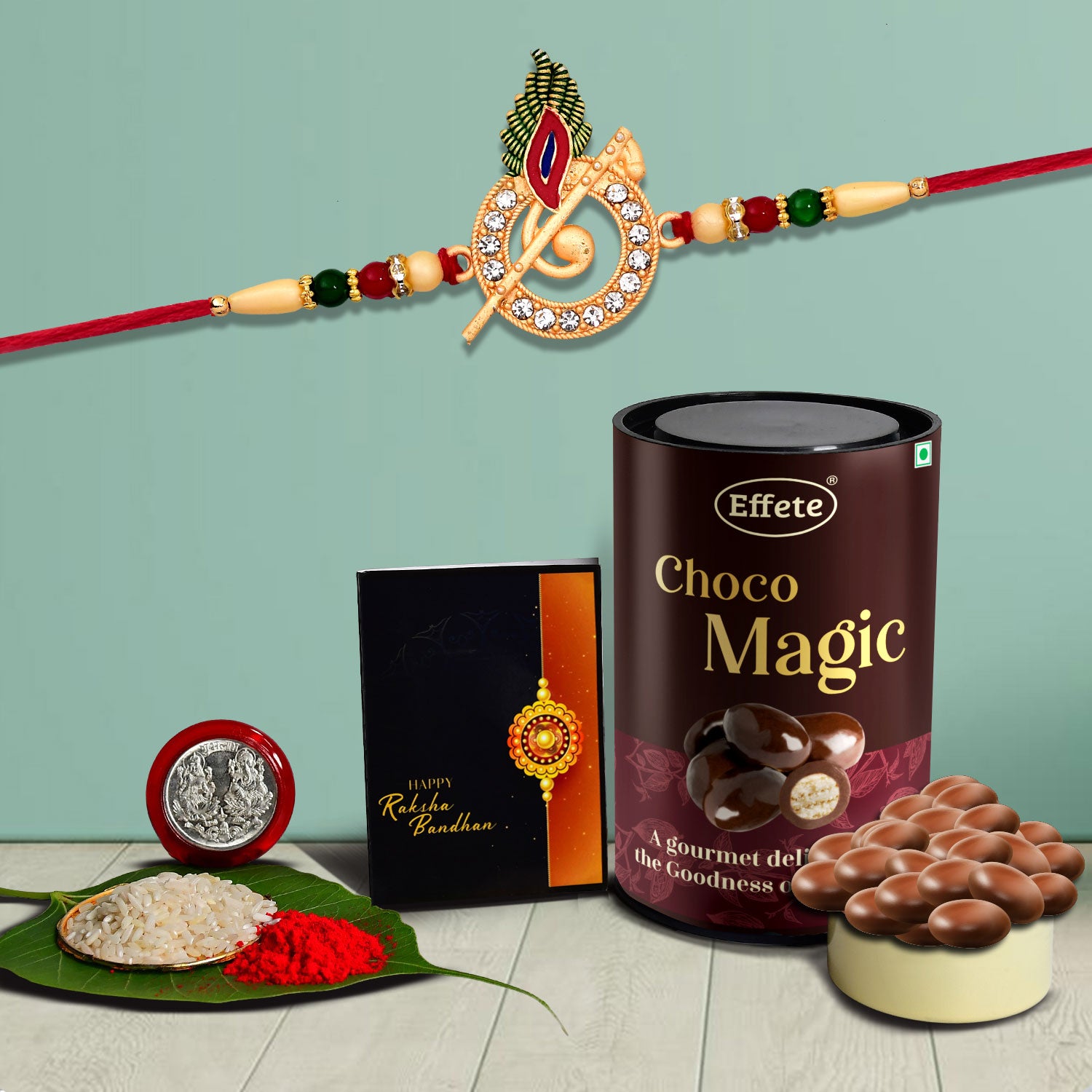 Rakhi combo gift set for brother with rakhi, roli-chawal, coin, greeting card, and chocolates.