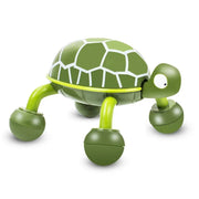 A vibrant green turtle-shaped massager with white shell patterns and four rolling legs is shown on a white background.