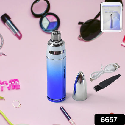 Person holding a nose and ear hair trimmer for personal grooming