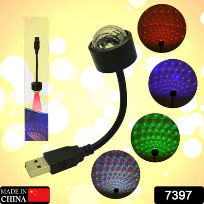 USB star projector creating a red starfield on a car ceiling