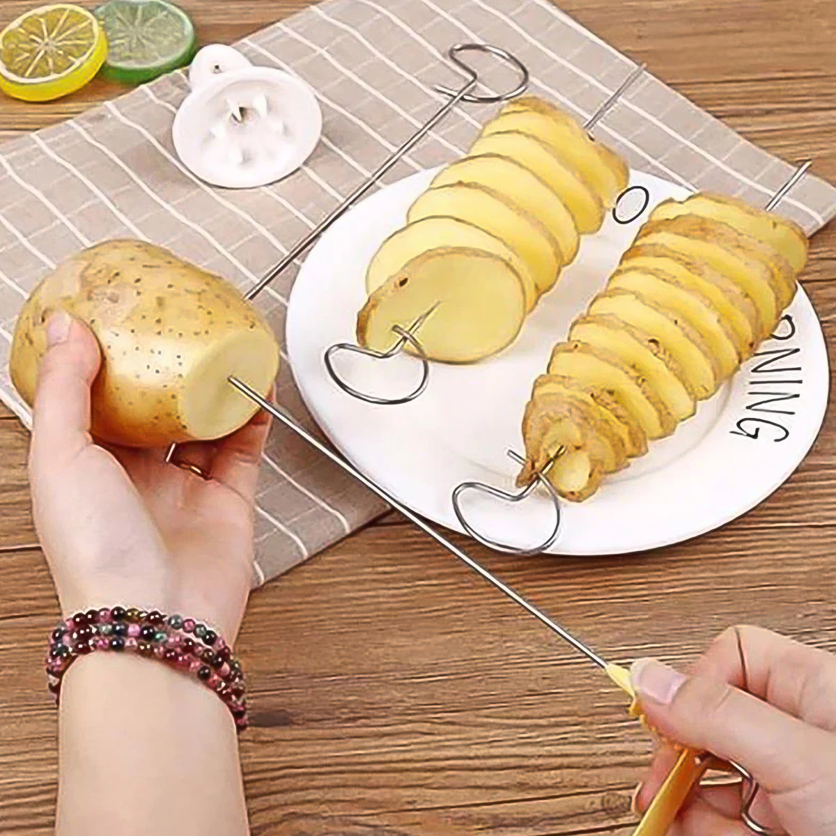 Person demonstrating how to use the manual potato spiral maker