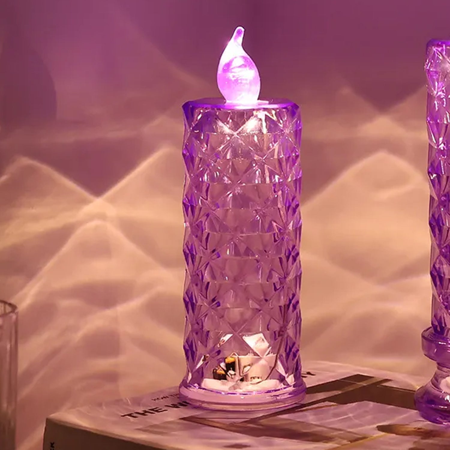 Close-up of crystal LED candlelight with shimmering liquid