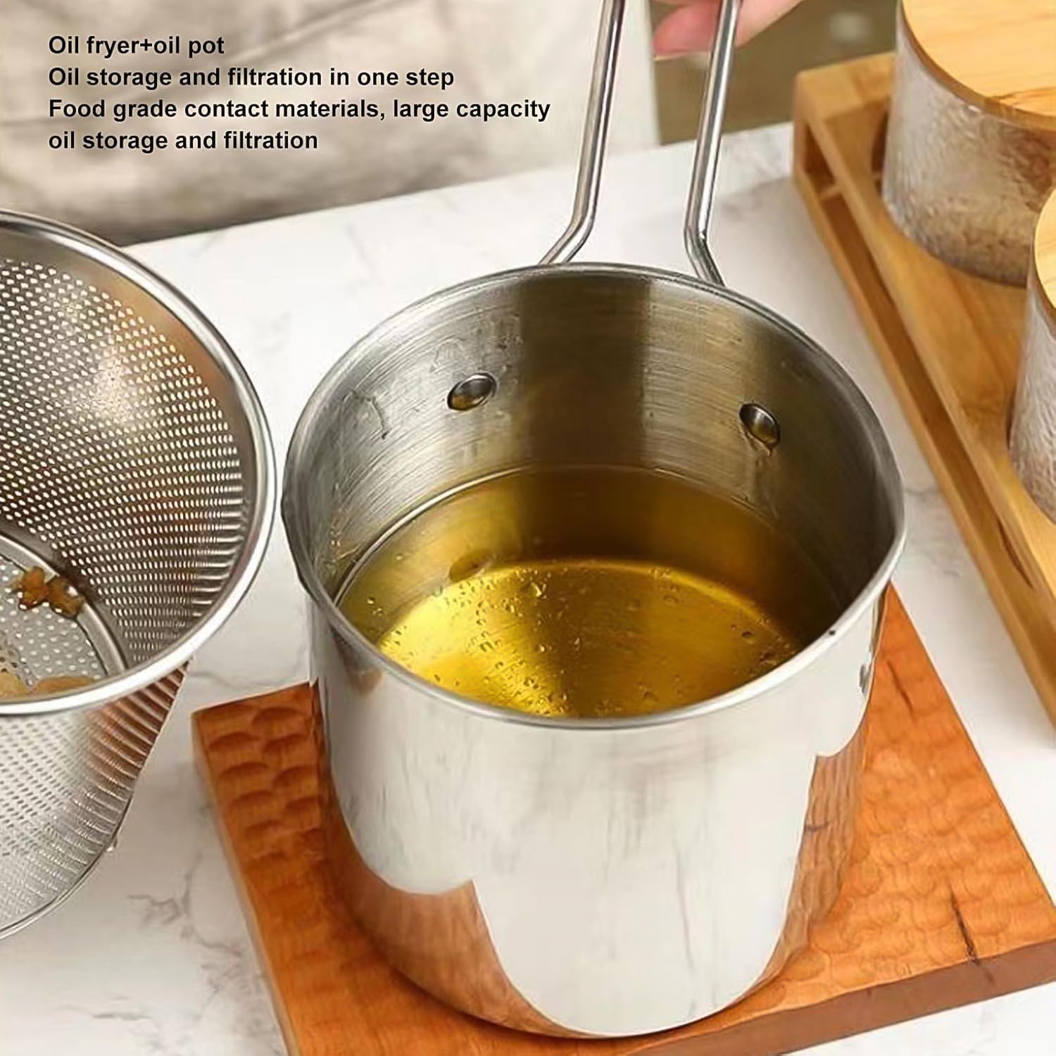 Strainer basket inside frying pot with fried food