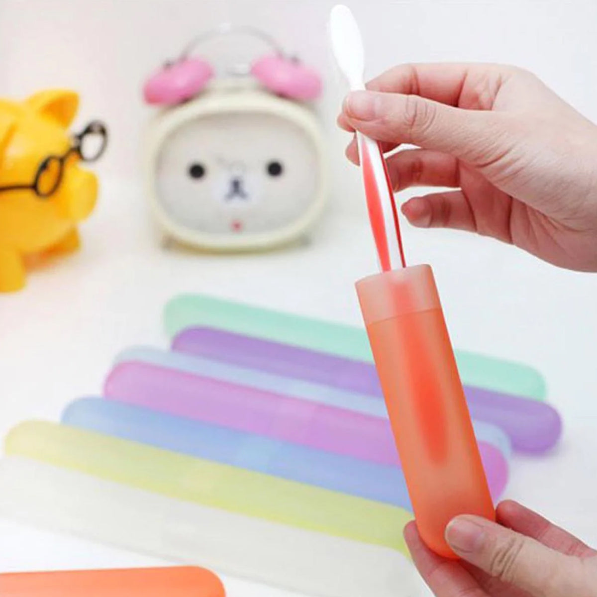 Multiple plastic toothbrush covers stacked for storage