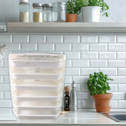Close-up of wall mounted food organizer rack with food items