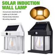 Side-by-side white and black solar wall lamps with clear bulbs and motion sensors, highlighting their design.