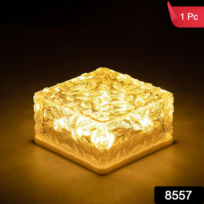 Solar Ice Cube Garden Light illuminating pathway at night