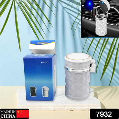 Portable car cupholder ashtray with blue LED light, placed in a car's console