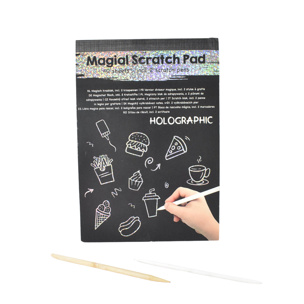 Wooden stylus next to scratch art sheets showing colorful artwork