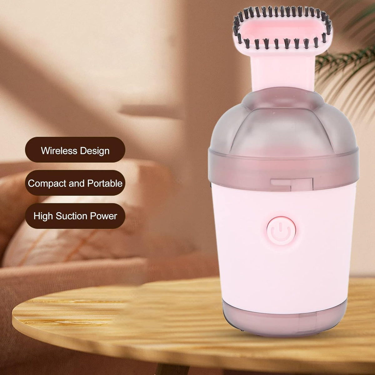 Hand holding the small, ergonomic desktop vacuum cleaner