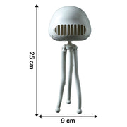 Compact mini projector fan on a desk for personal cooling