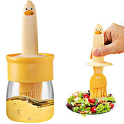 Close-up of the 2-in-1 glass oil dispenser bottle with silicone basting brush