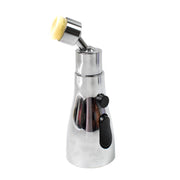 A shiny chrome faucet aerator with a yellow brush head attachment, isolated on a white background.