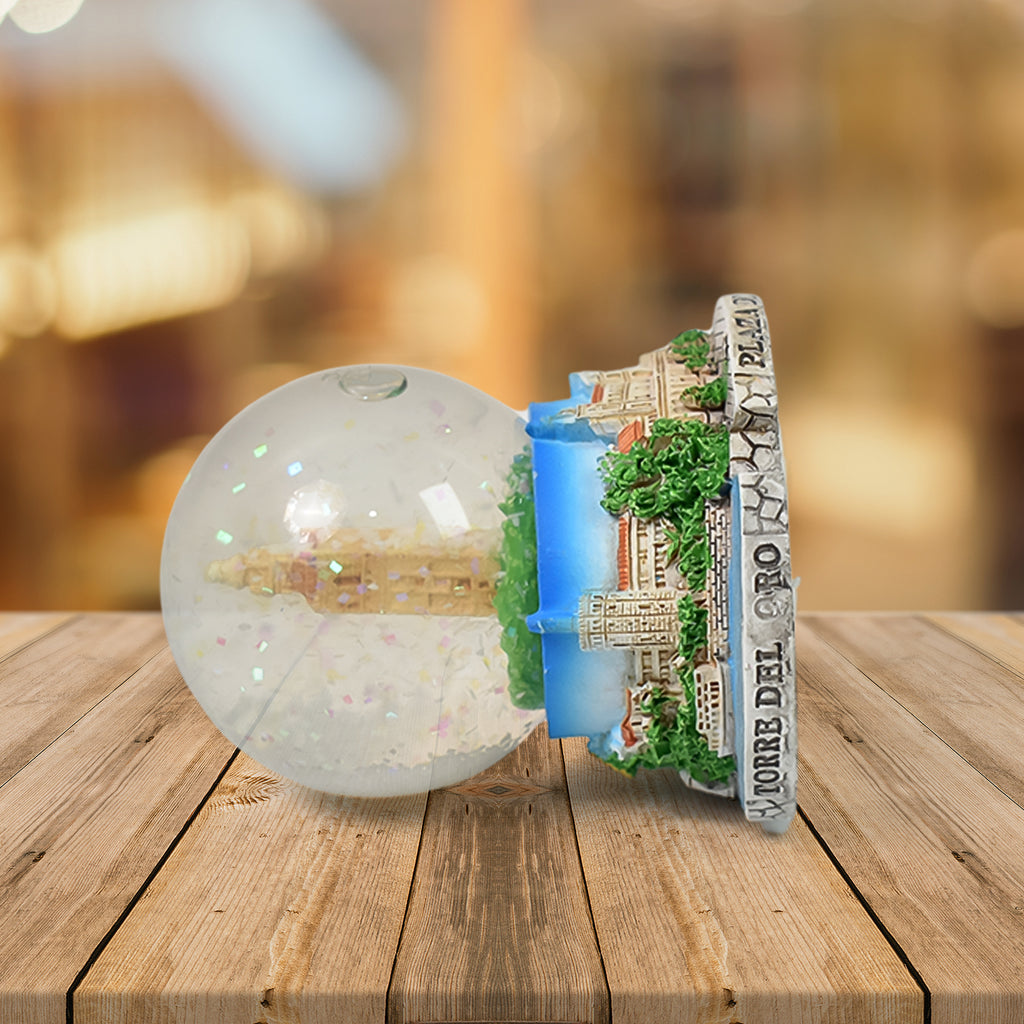 Decorative snow globe souvenir placed on table