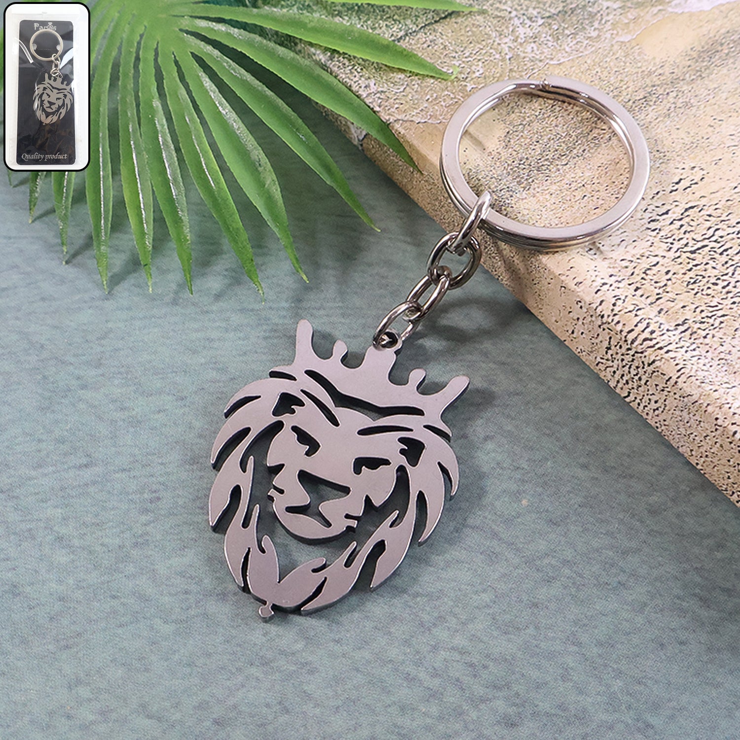 Durable metal lion head keychain on white background