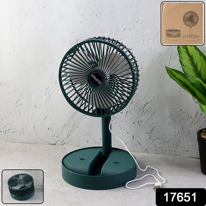 Wukusy Foldable Mini Desk Fan extended on a modern workspace, providing cool air.