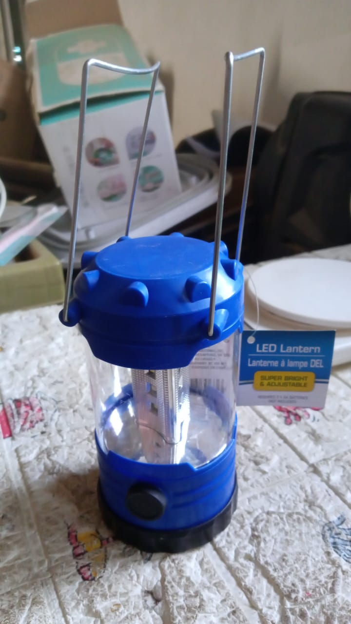 12690 camping lantern illuminating dark tent interior