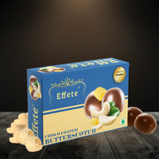 Effete Choco Coated Butterscotch box with loose cashews and chocolates on a dark wooden surface.
