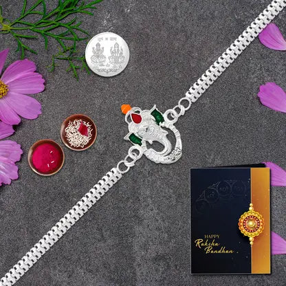 Ganesh Rakhi Gift Combo with silver-plated rakhi, coin, roli-chawal, chocolate & greeting card