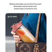 Portable blender actively mixing a drink with visible ingredients