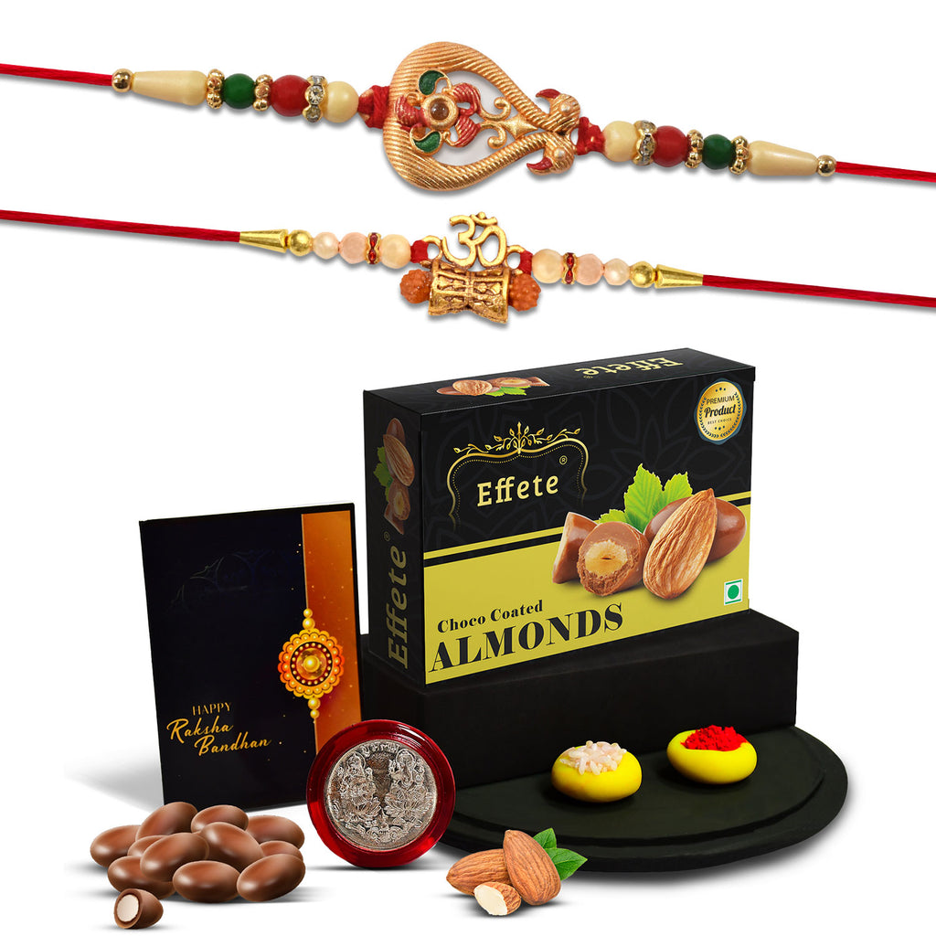 Close-up of a fancy Rakhi bracelet, delicious choco almond treats, and a silver pooja coin.