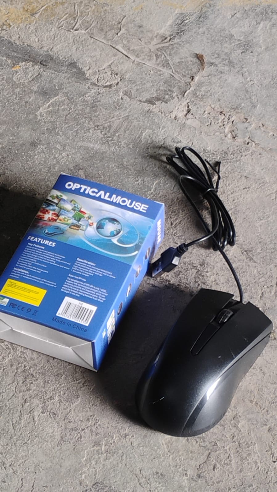 Packaging for the Wukusy Wired Optical Mouse, showcasing product branding and key features.